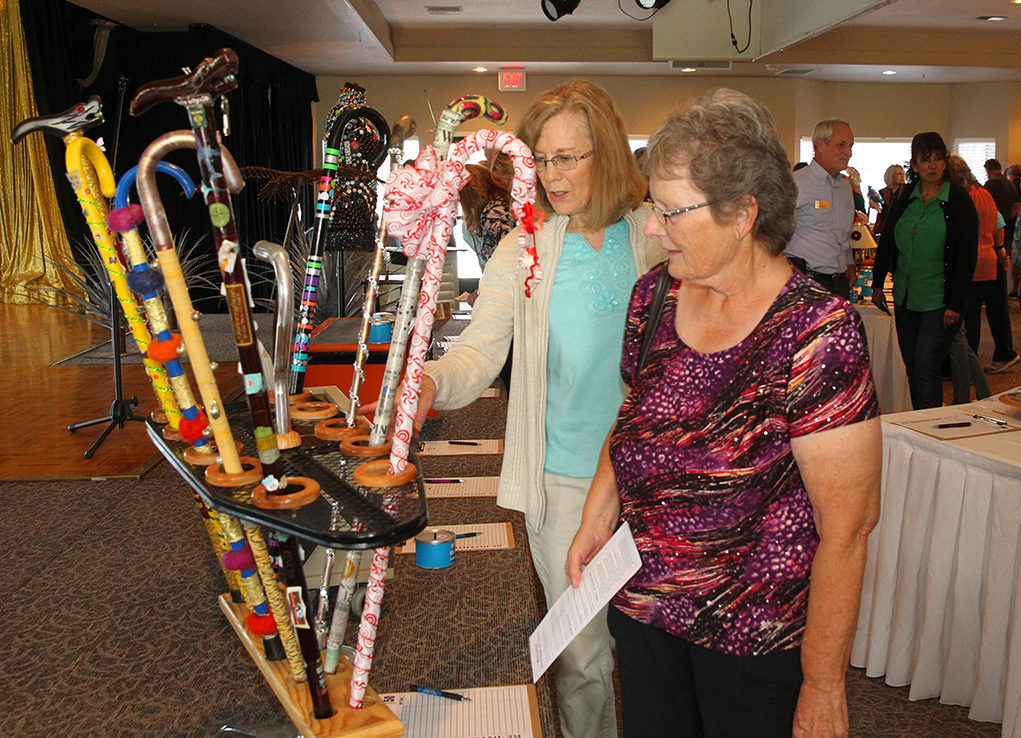 Meri Anderson and Adene Kimball look over re invented items Saturday afternoon at the Hospice of Havasu fundraiser. Jillian Danielson/RiverScene 