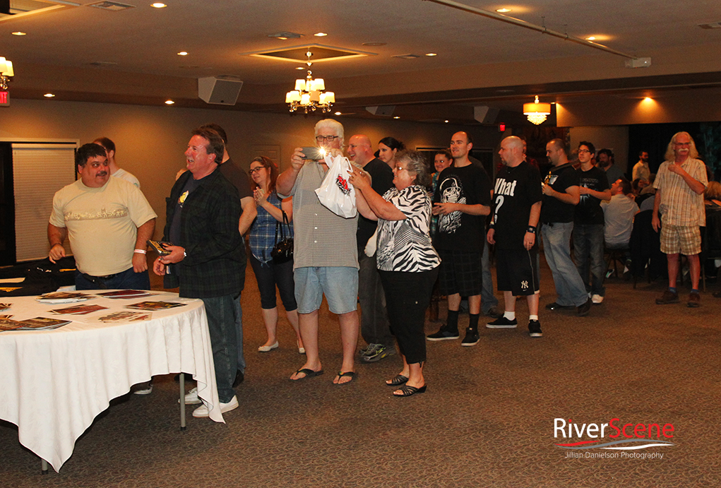 Fans line up for autographs with Mick Foley at a comedy night sponsored by Pennington's Pub at the London Bridge Resort.  