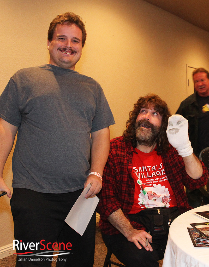 A fan gets his photo with Mick Foley Saturday evening. 