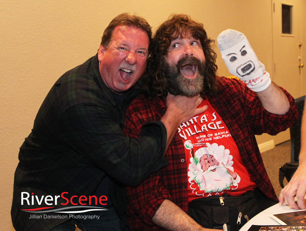 A fan gets his photo with Mick Foley Saturday evening at London Bridge Resort. 
