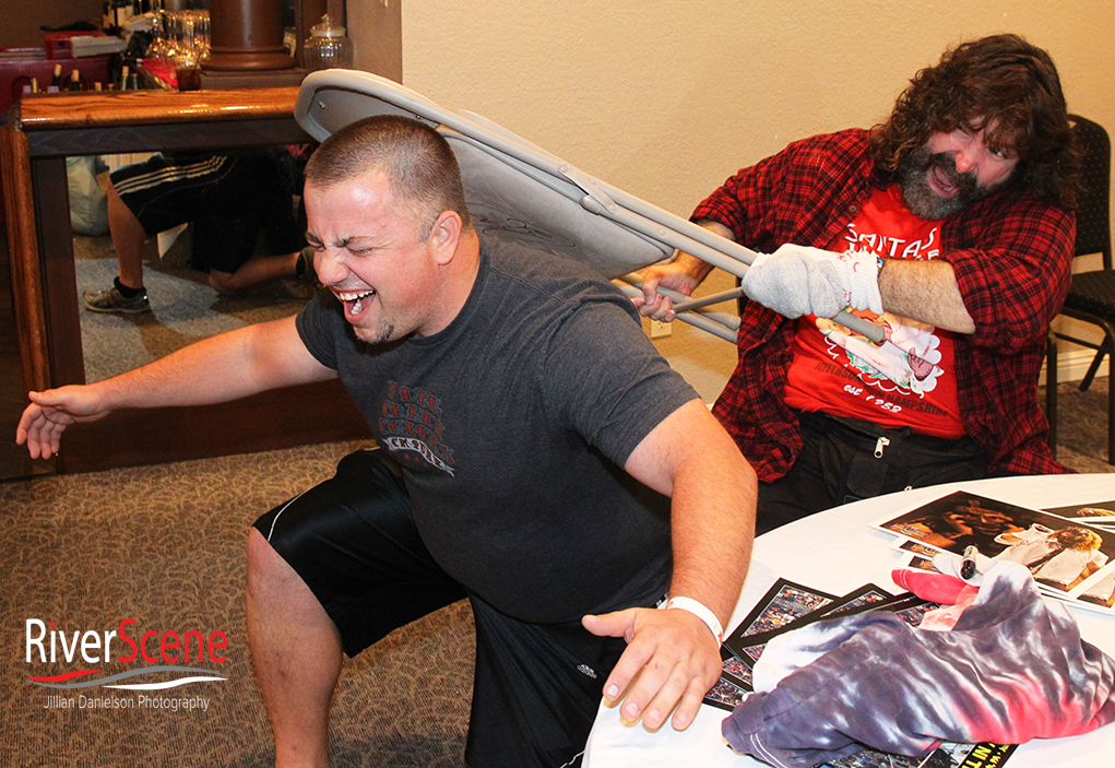 John Jones pretends to have Mick Foley hit him with a chair at the London Bridge Resort. 
