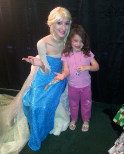 Maisy Samuelson , dressed as Queen Elsa, poses with a child during a Christmas event at Tranquility.  Submitted photo by Heather Pace 