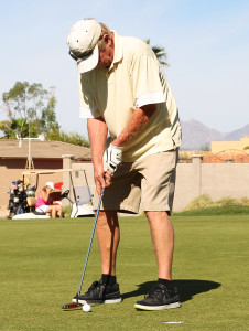 Bob Farrell putts during the Military Moms Golf Tournament. Jillian Danielson/RiverScene 