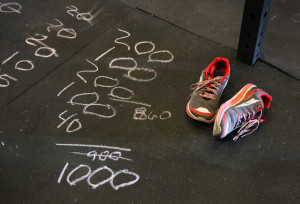 Burpees by the 100s are drawn on the floor to help keep track on how many to do. Jillian Danielson/RiverScene 