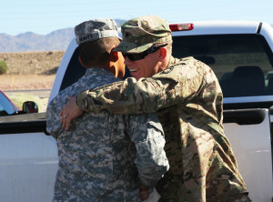 SPC Justin Penikas hugs SSgt. Miguel Montes Saturday morning at the Welcome Home Ceremony. Jillian Danielson/RiverScene