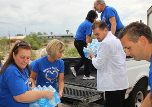 Hospital staff unload water at the food bank Tuesday morning. Jillian Danielson/RiverScene 