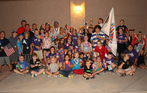 Starline Elementary students pose with USA riders Tuesday evening before the Parade of Nations. 