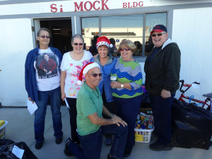 Volunteers that sorted toys and food for families pose for a photo at Desert Hills Fire Department. Submitted photo Shirley and Hal Ries 