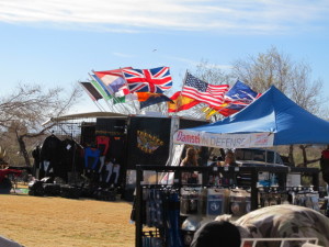 Flags flew stiff in the 20 mile-per-hour winds today at the Legends of Route 66 event. Judy Lacey/RiverScene 