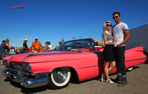 Caron Scheeler and Andrew Gronefeld pose with a 1956 pink Caddy Saturday afternoon at Rockabilly Reunion. Jillian Danielson/RiverScene