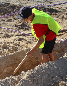 James Nelson digs a trench Thursday morning on the Island. Jillian Danielson/RiverScene 