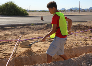 Jace Taylor digs a trench on the Island Thursday morning. Jillian Danielson/RiverScene 