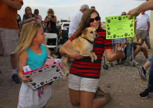 The winners of the Chihuahua races are first place Emerald Noble holding "Shiver" and second place Kadi Dokter holding "Brando." Jillian Danielson/RvierScene 