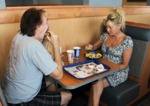 Randy and Susan Habeck eat their burger and salad Monday afternoon during the grand opening of Culvers. Jillian Danielson/RiverScene 