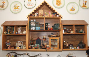 A wooden dollhouse hangs on a wall in the home of Angela and David. Jillian Danielson/RiverScene 