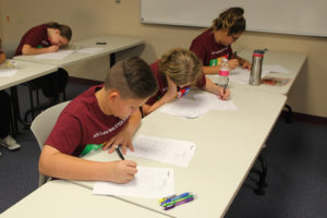 HPA students works on math problems Friday morning at ASU. Jillian Danielson/RiverScene 
