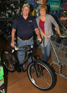Larry and Brenda Sanders shop for a family Tuesday evening. Jillian Danielson/RiverScene 