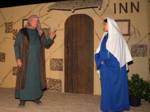 Bob Broadie and Sarah Myhre pose in the Innkeeper scene during the Live Nativity. Jillian Danielson/RiverScene 