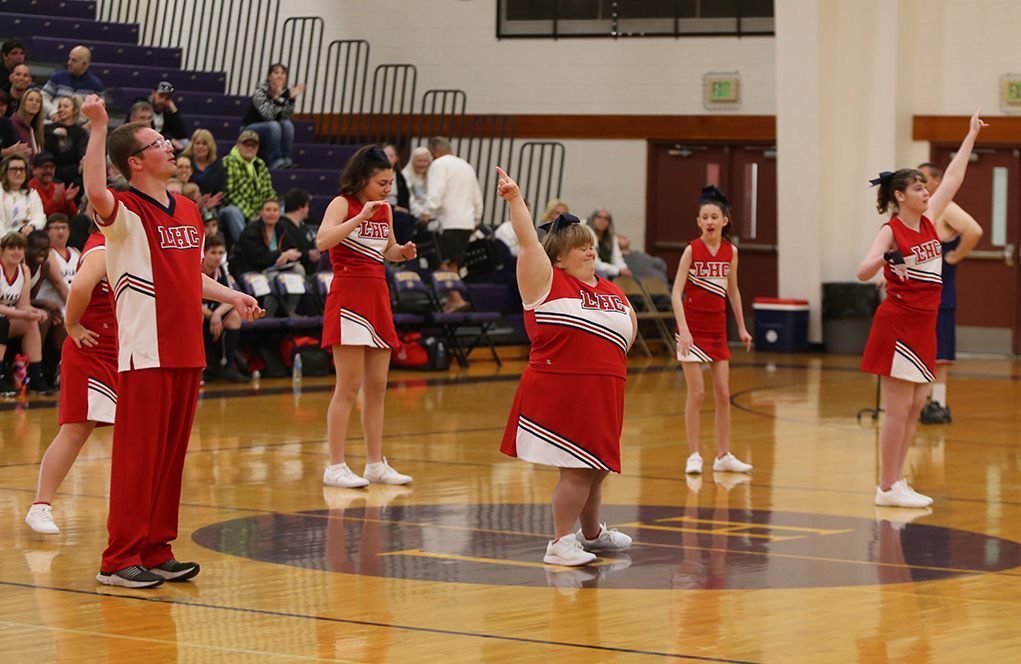 The Special Olympics Havasu Heat Cheer Team leads the crowd in cheers at the basketball scrimmage. Jillian Danielson/RiverScene