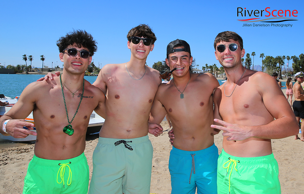 Spring Breakers pose for a photo at Rotary Beach Friday dressed in green for St. Patrick's Day. Jillian Danielson/RiverScene