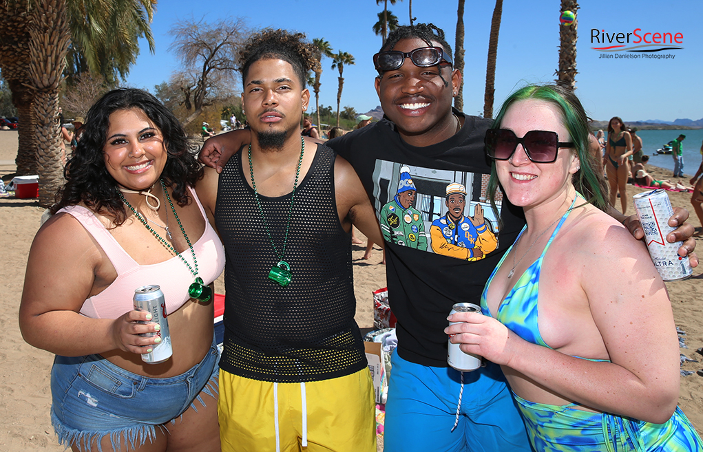 Spring Breakers pose for a photo Friday at Rotary Beach. Jillian Danielson/RiverScene 