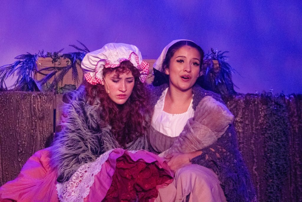 Samantha Reed as Little Red Riding Hood and Betsy Heredia as Cinderella in Into the Woods